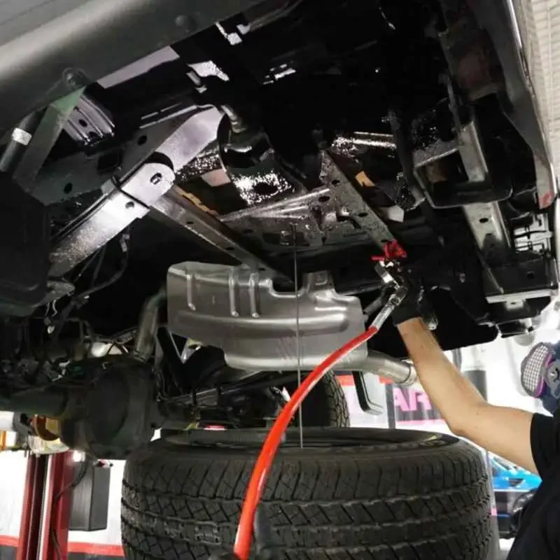 Vehicle on outdoor underbody wash lift in Callan